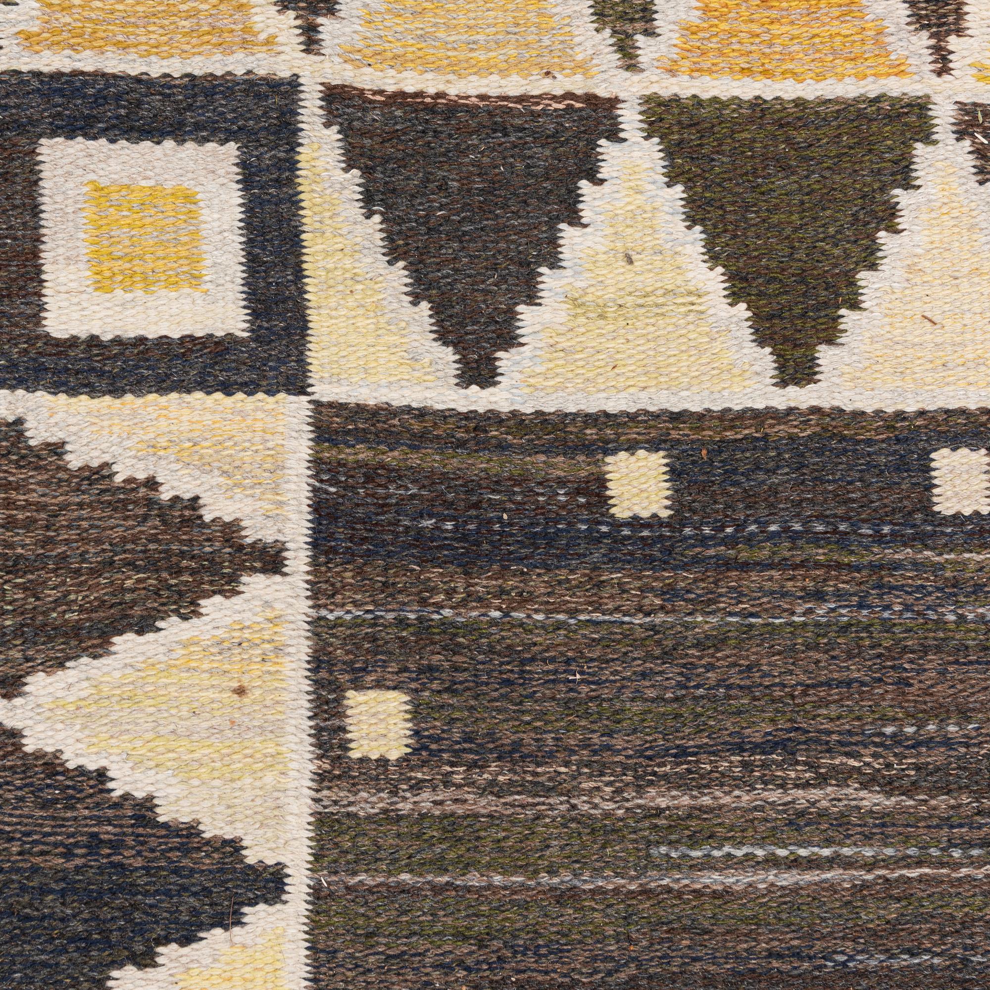 A flat weave rug, c. 245 x 185 cm.