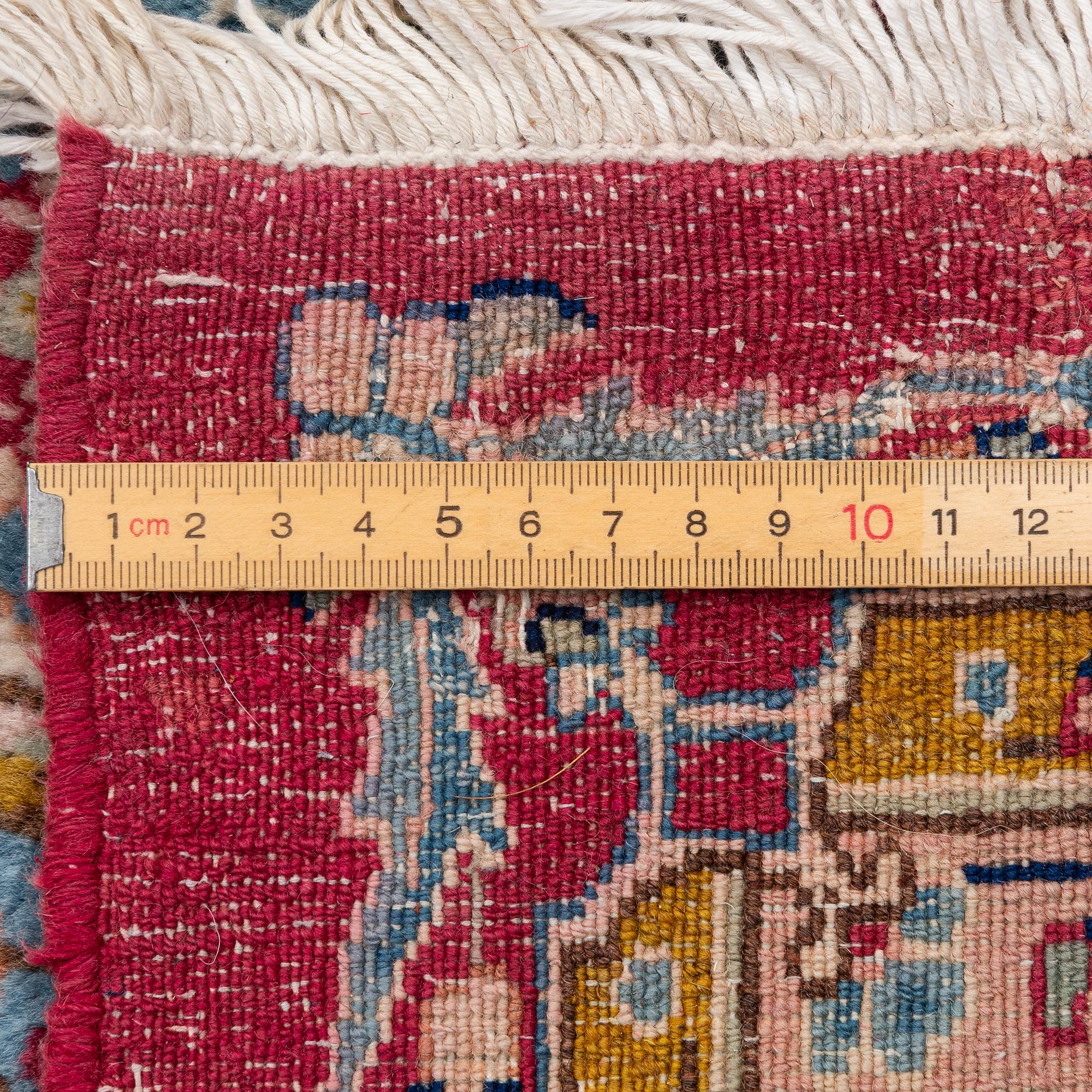 A Kirman carpet, signed, c. 388 x 279 cm.