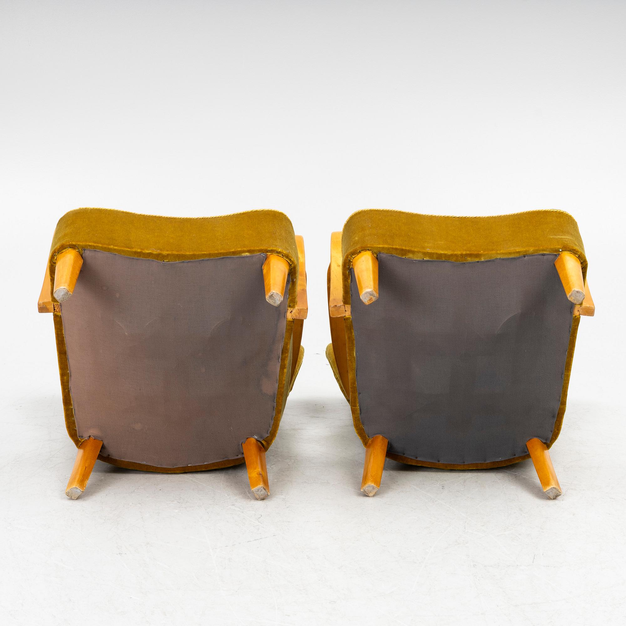 A pair of wingback armchairs, Sweden, first half of the 20th century.