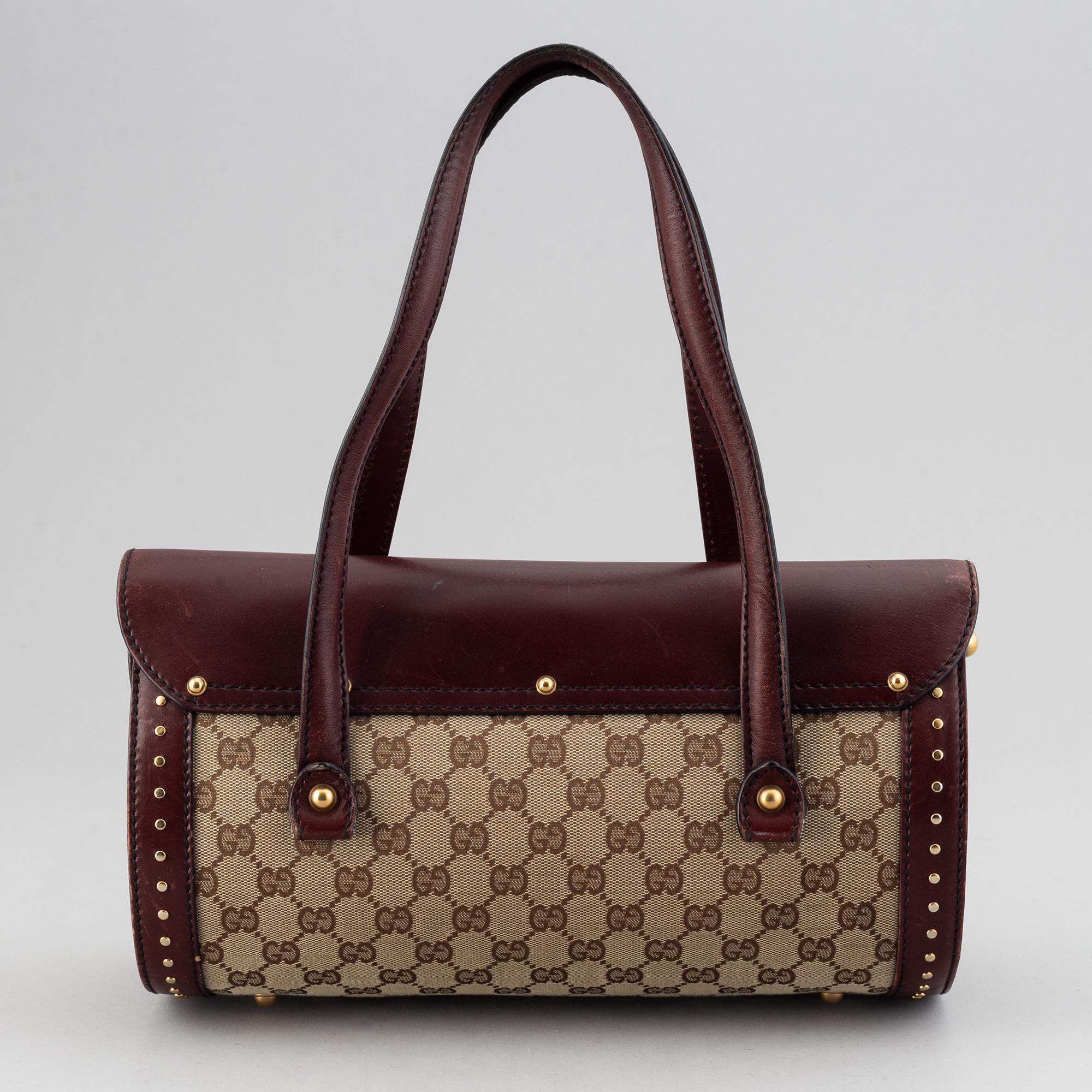 Gucci, a monogram canvas bag.