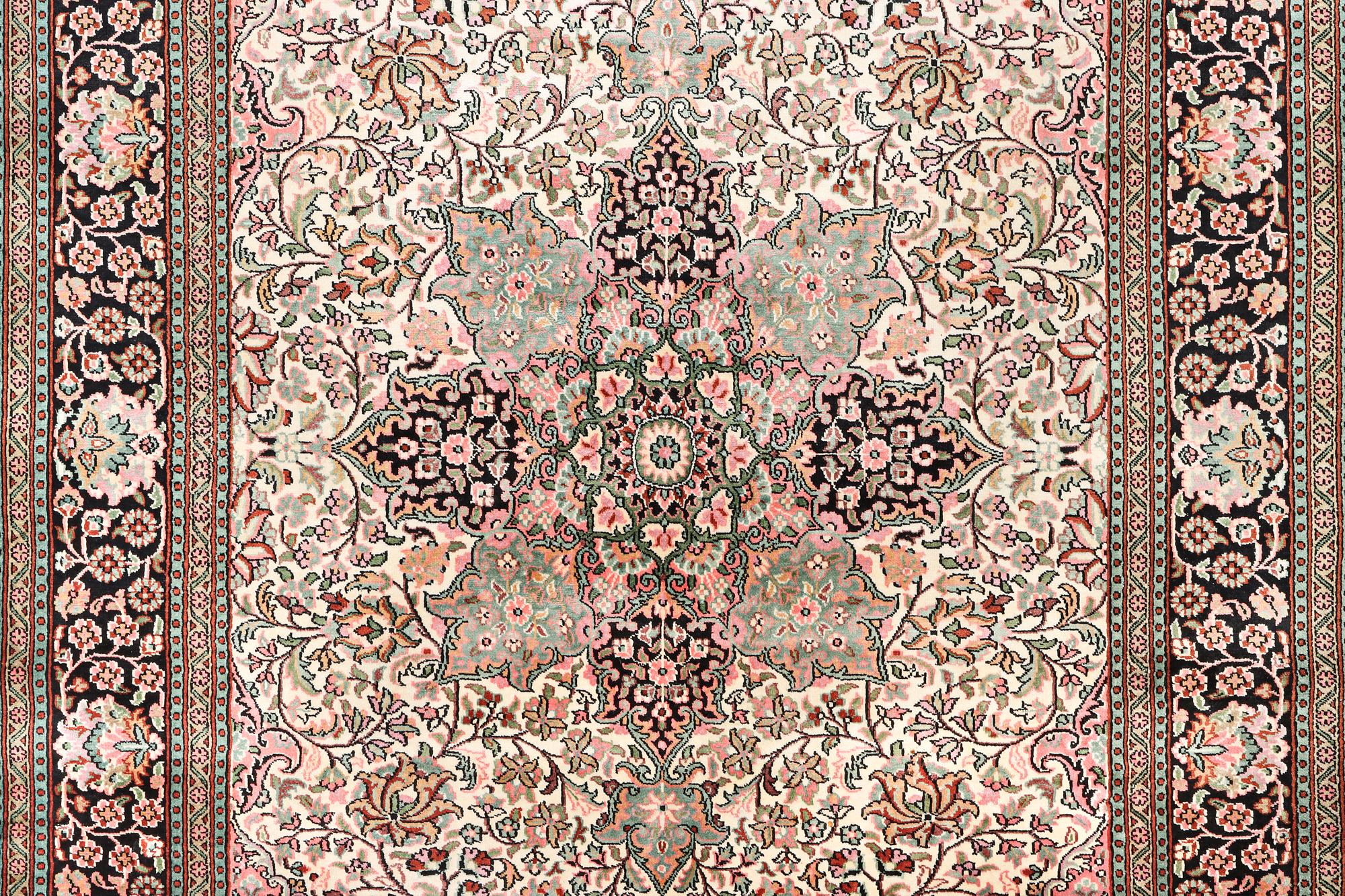 A silk Kashmir carpet, c. 267 x 185 cm.