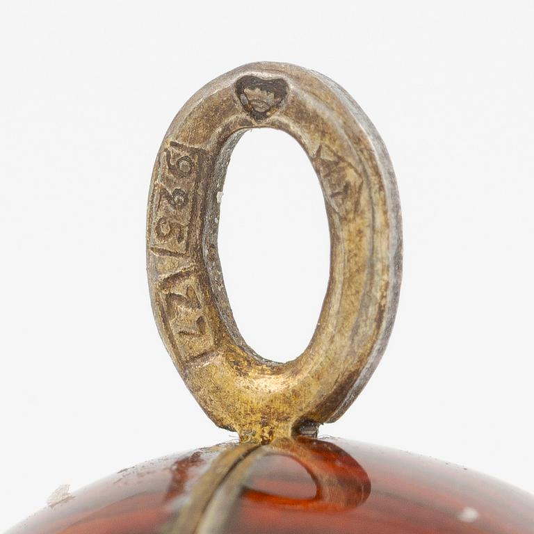 Pendant in the shape of an egg, silver with red enamel.