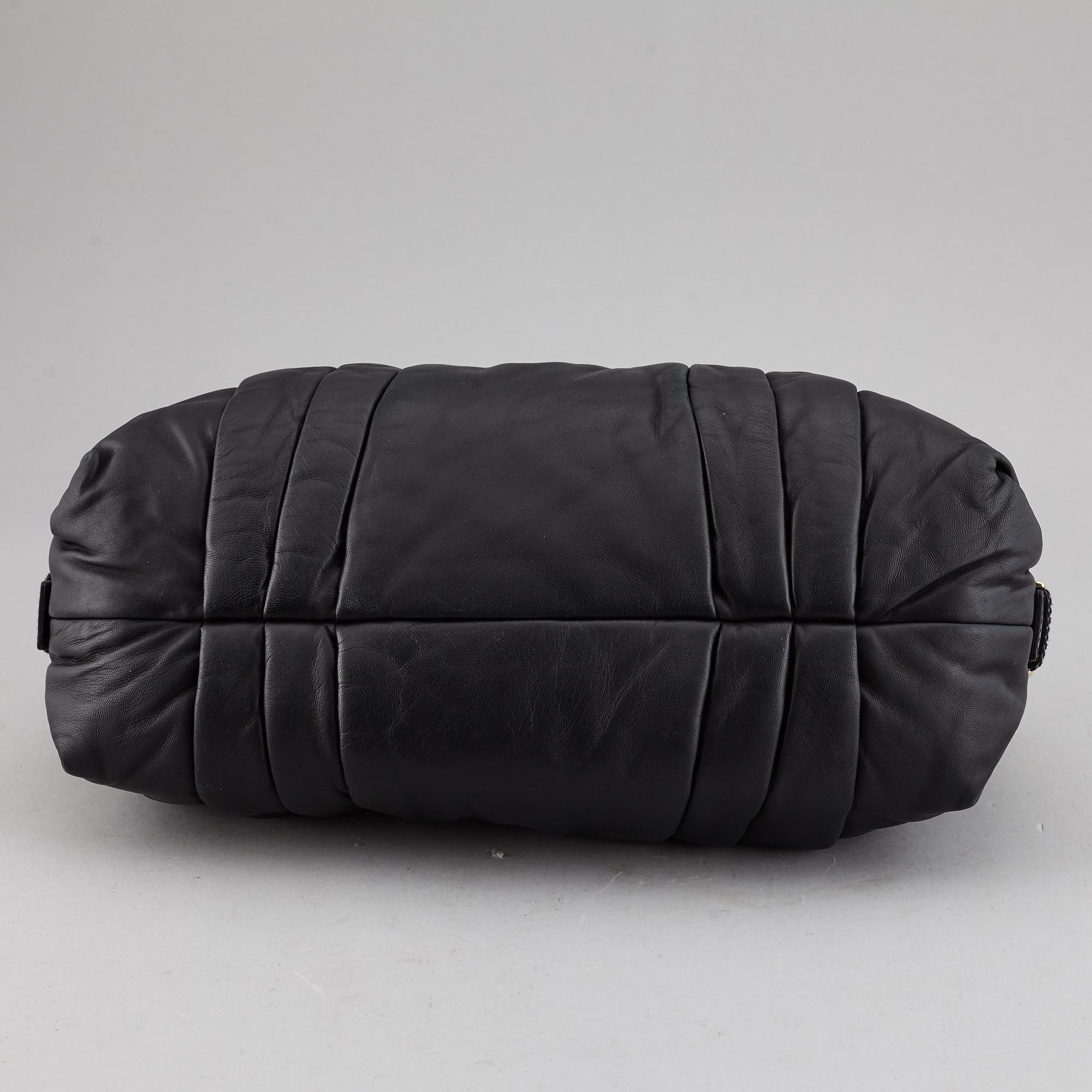 DOLCE & GABBANA, a black leather bag.