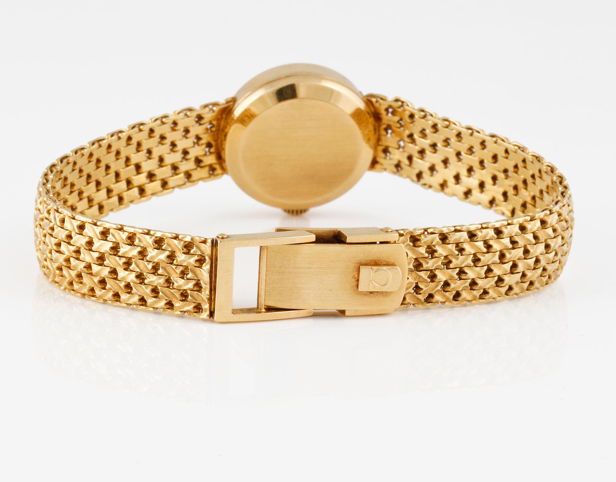 ARMBANDSUR, dam, guld, "Ladymatic" Omega. Total vikt 39 g.