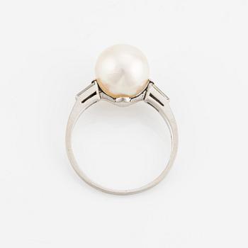 Platinum ring with pearl and baguette-cut diamonds.