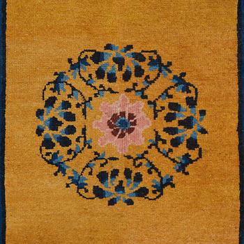 A RUG, an old China, ca 177,5 x 92,5 cm.