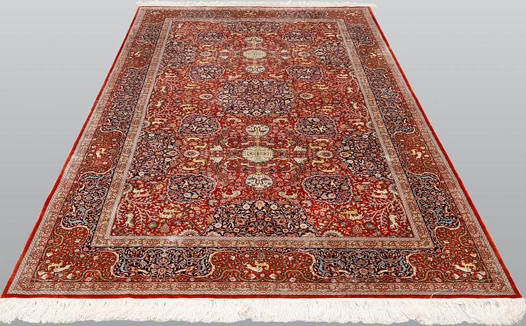 A pictoral orietal silk rug, 246 x 153 cm.