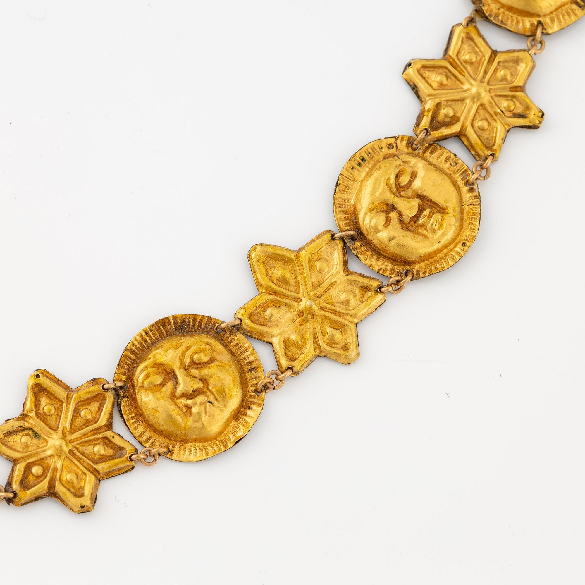 A modern Egyptian-style gold and pearl necklace.