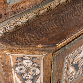 A Swedish Dalecarlian folk art cabinet dated 1808.