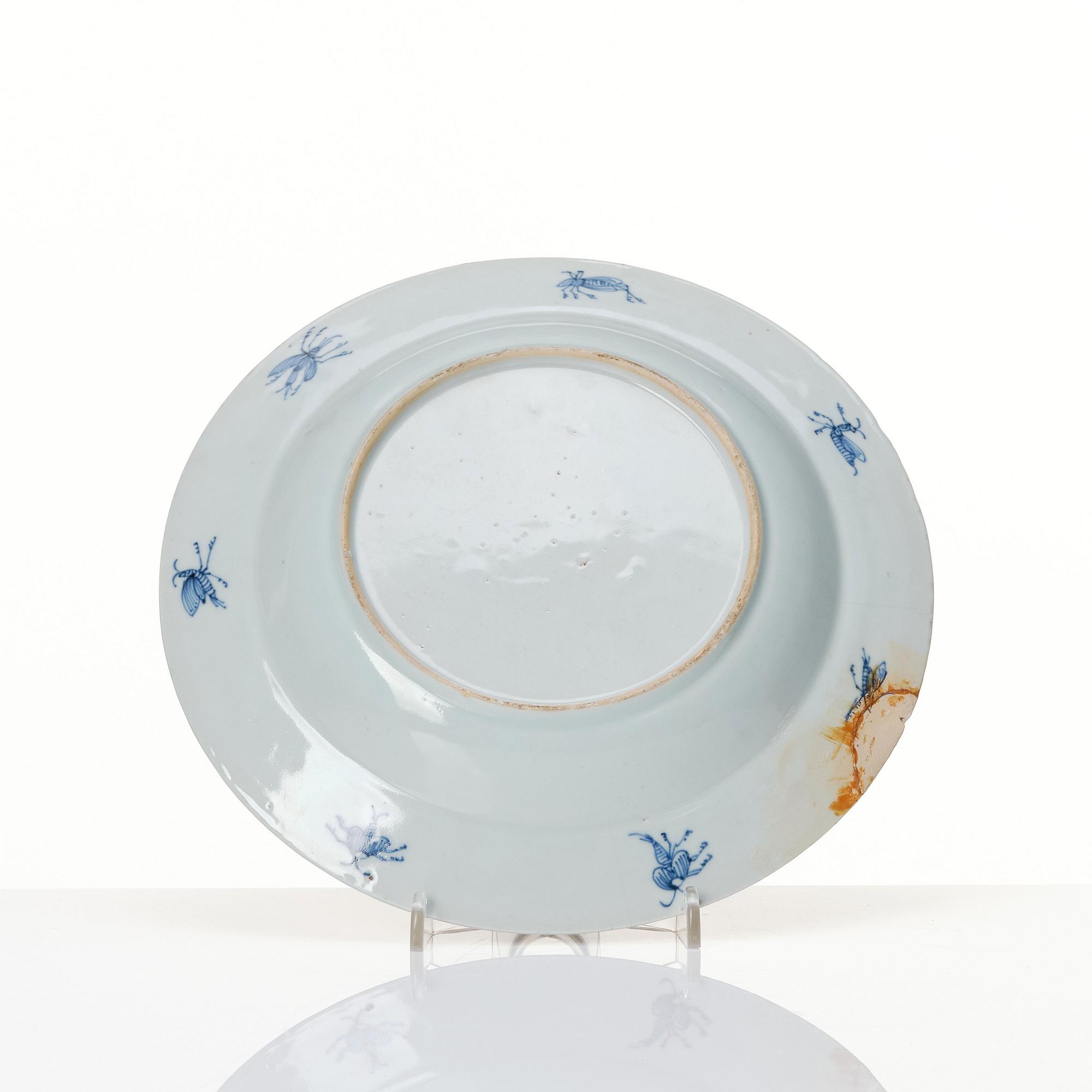 Chinese Imari ’Dame au Parasol’ plate decorated in underglaze blue, iron-red and gilt, Qing dynasty, Qianlong 1730-40.