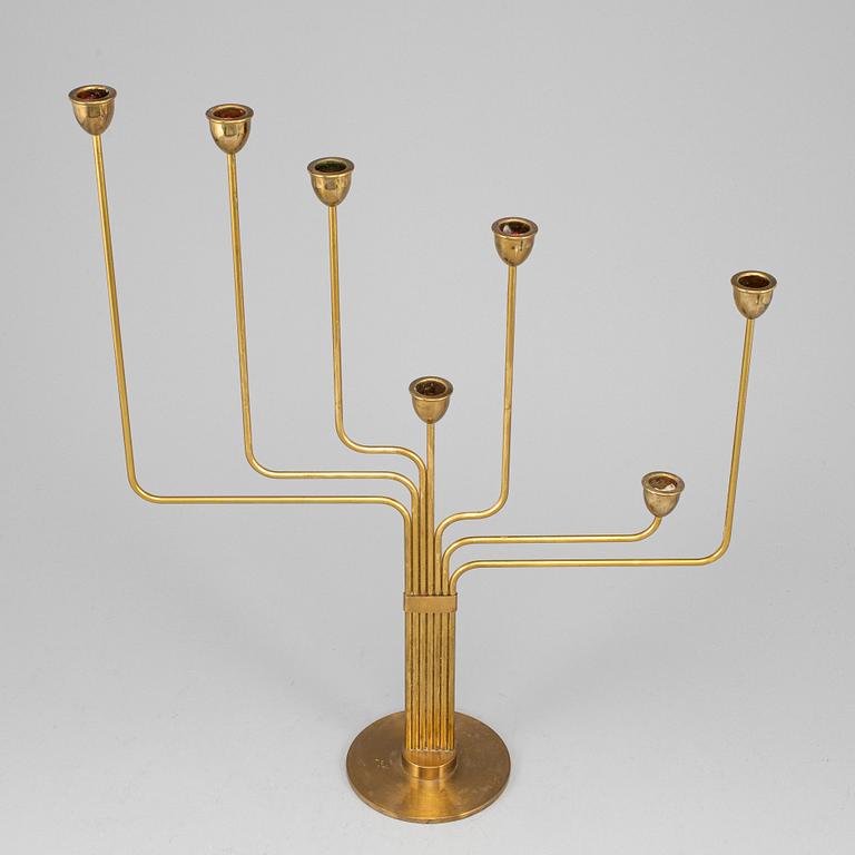 PIET HEIN, an 'Ursa Major' brass candelabrum, Denmark, designed in 1953.