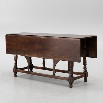 A gate-leg dining table, England, first half of the 20th century.