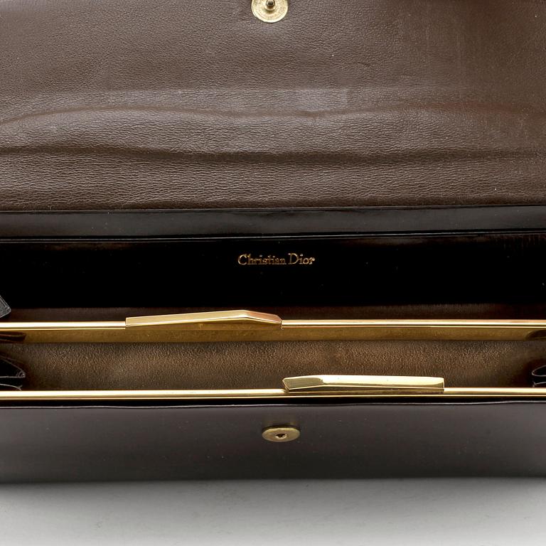 CHRISTIAN DIOR, a brown calf leather clutch / evening bag.