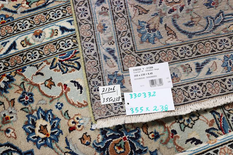 A Kashan carpet, c. 355 x 238 cm.