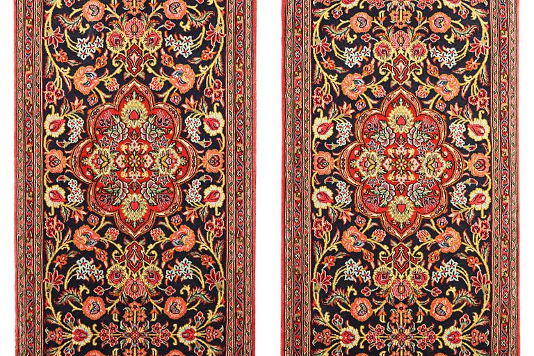 A pair of Quum rugs, c. 176 x 60 cm & c. 178 x 58 cm.