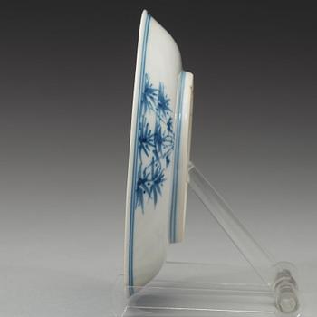 A blue and white dish, Qing dynasty, with Guangxus six character mark and of the period (1875-1908).