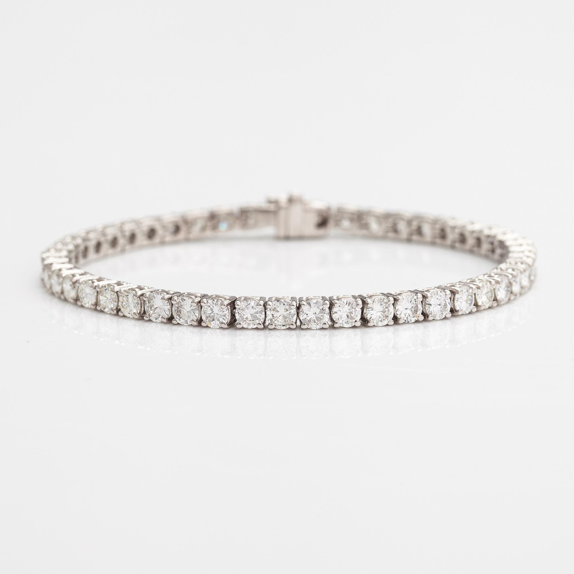 Tennisrannekoru, 18K valkokultaa, briljanttihiottuja timantteja n. 7.00 ct yht.