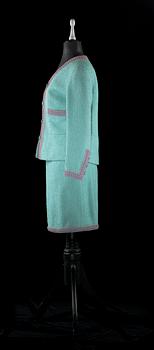 A 21 th cent green bouclé two-pieces costume by Chanel.