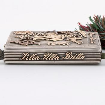 Silver box, gold, enamel, rose-cut diamonds, saphires and rubies (possibly synthetic), silk chord, St Petersburg.