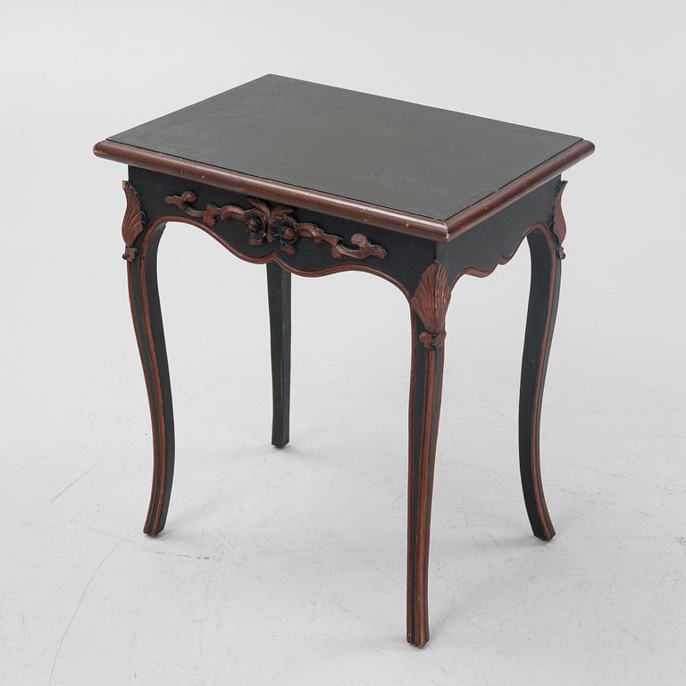 A painted table with a drawer, 20th Century.