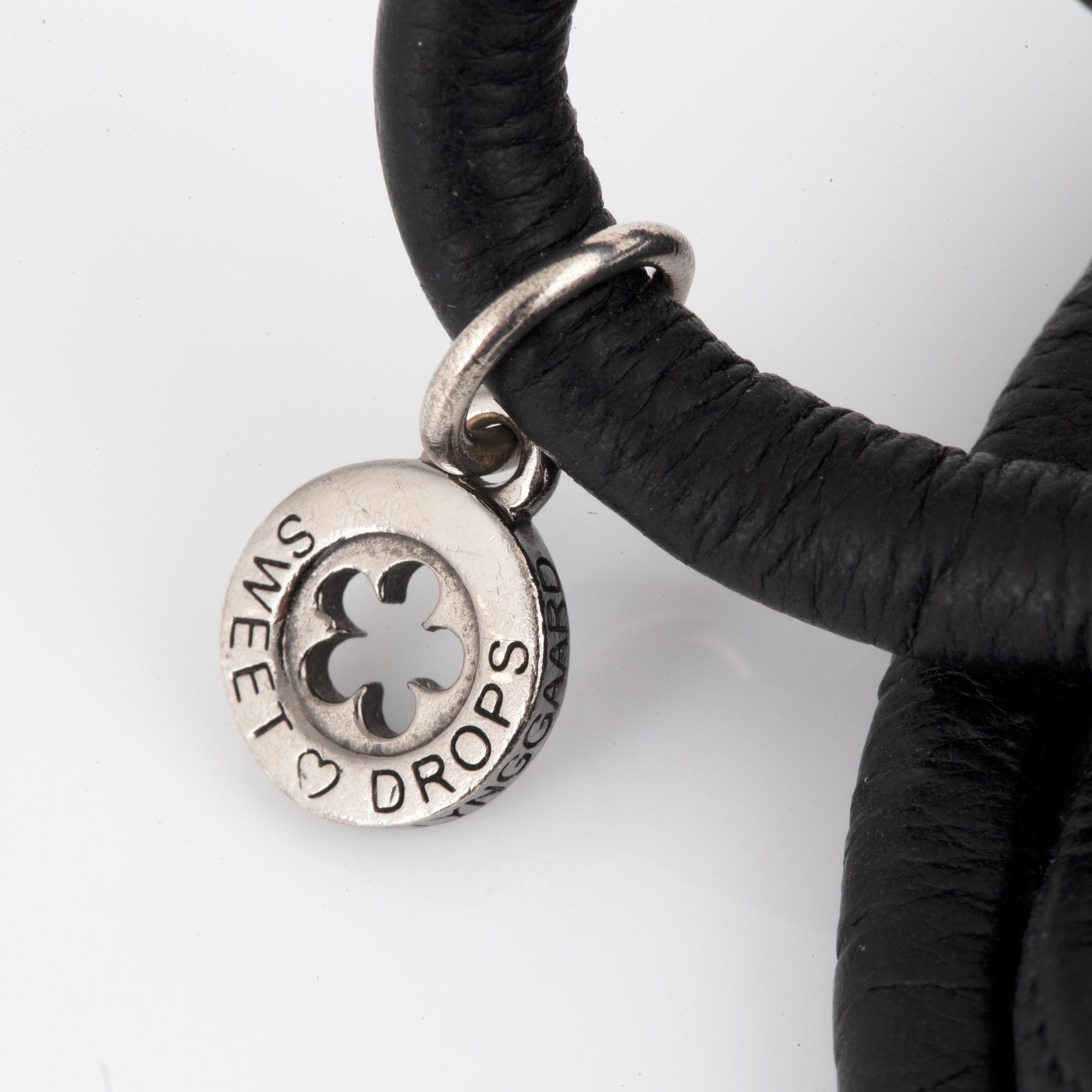 OLE LYNGGAARD,  "sweet drops", armband samt berlock i silver med briljantslipad diamant.