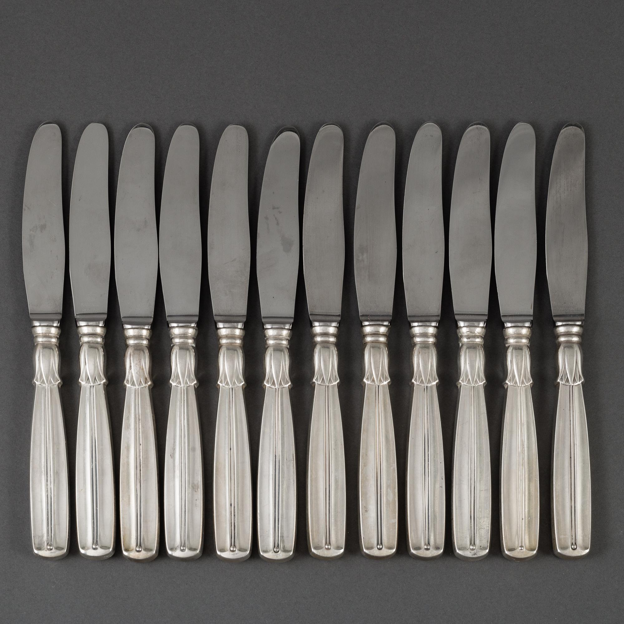 A set of 12 silver and steel knives, model Lotus, Denmark. 20th century.