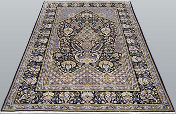 A signed part silk Kashan rug, c 210 x 140 cm.