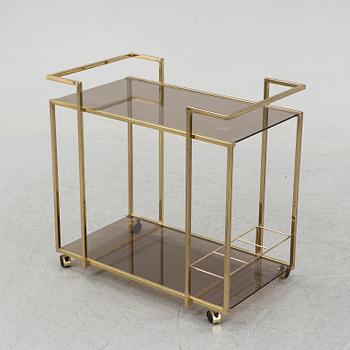 A brass and glass drink trolley, end of the 20th Century.