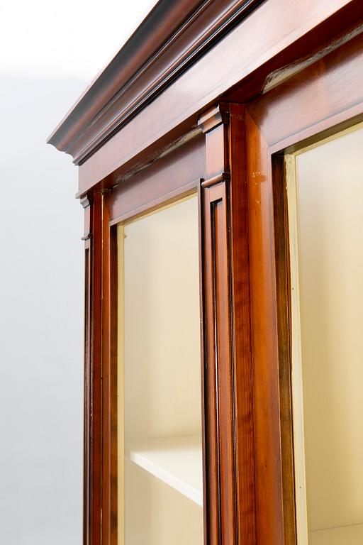 A modern mahogany display cabinet.