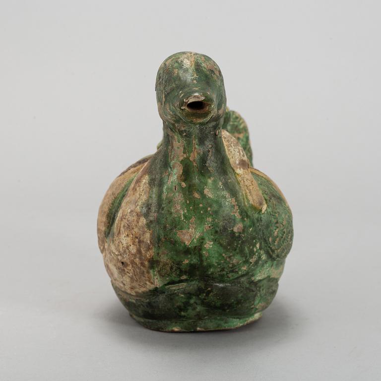 A green and yellow glazed bisquit duckshaped ewer, Ming dynasty (1368-1644).