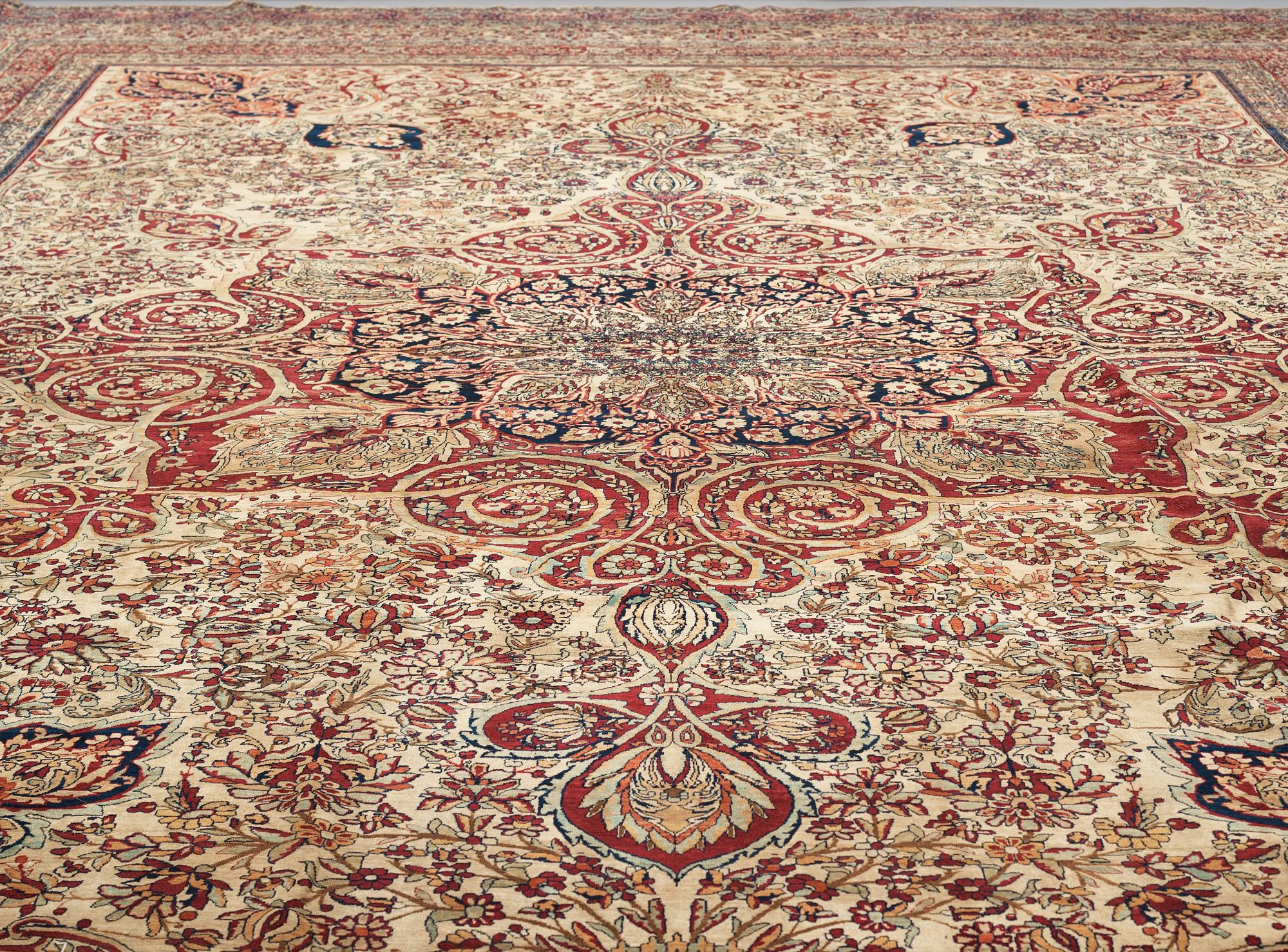 A carpet, an antique Kerman Laver, ca 677-688,5 x 510,5-526 cm.