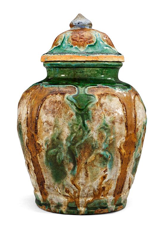A green, brown and white glazed jar, Ming dynasty (1368-1644).