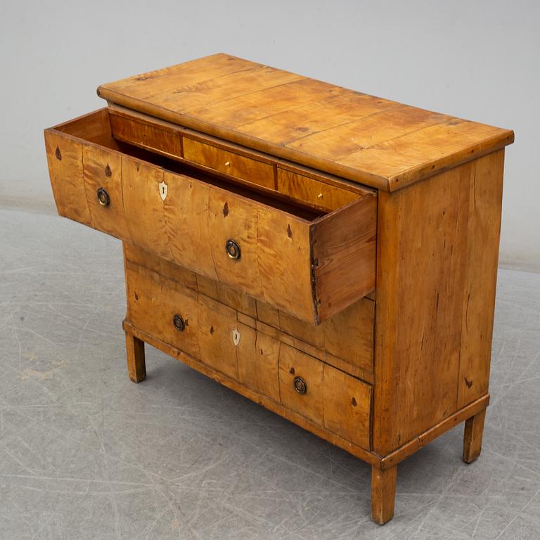 An early 19th century chest of drawers.