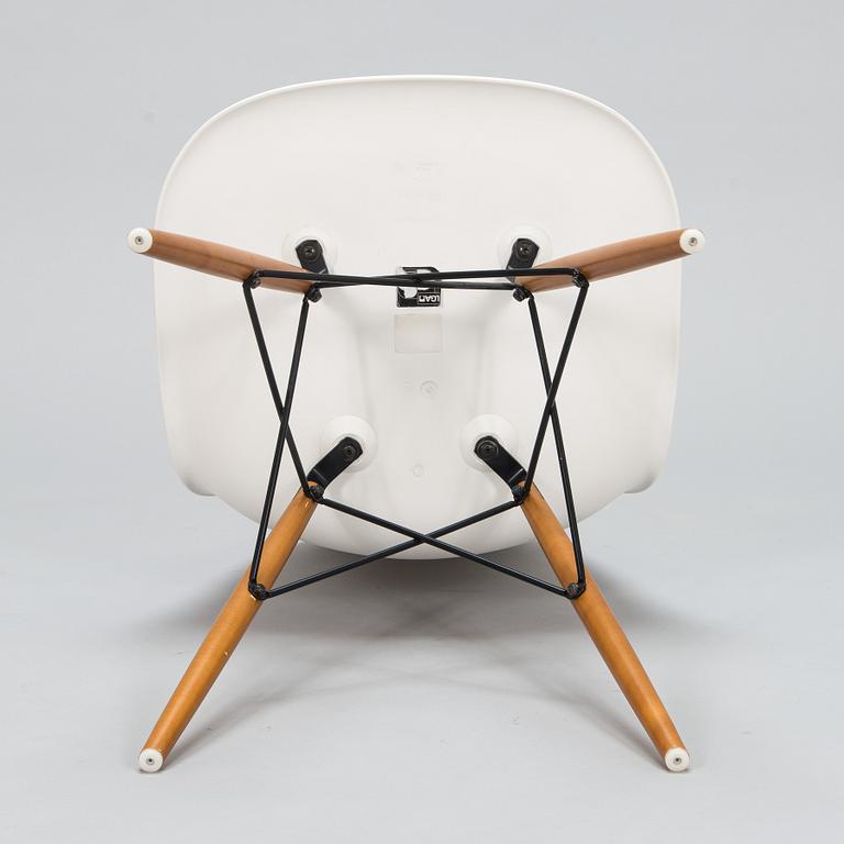 A 'Plastic chair DSW' by Charles and Ray Eames for Vitra.