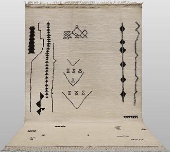 A Moroccan design carpet, c. 306 x 201 cm.