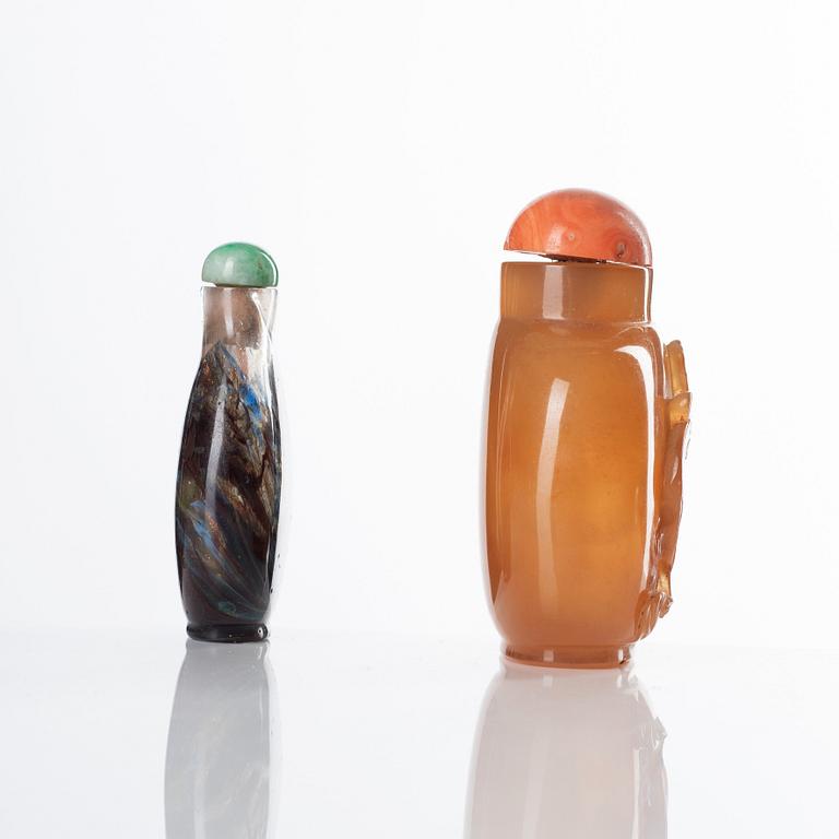 Two Chinese snuff bottles with stoppers, 20th Century.