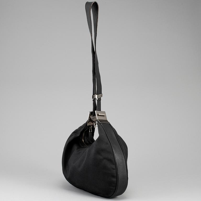 GUCCI, a canvas handbag.