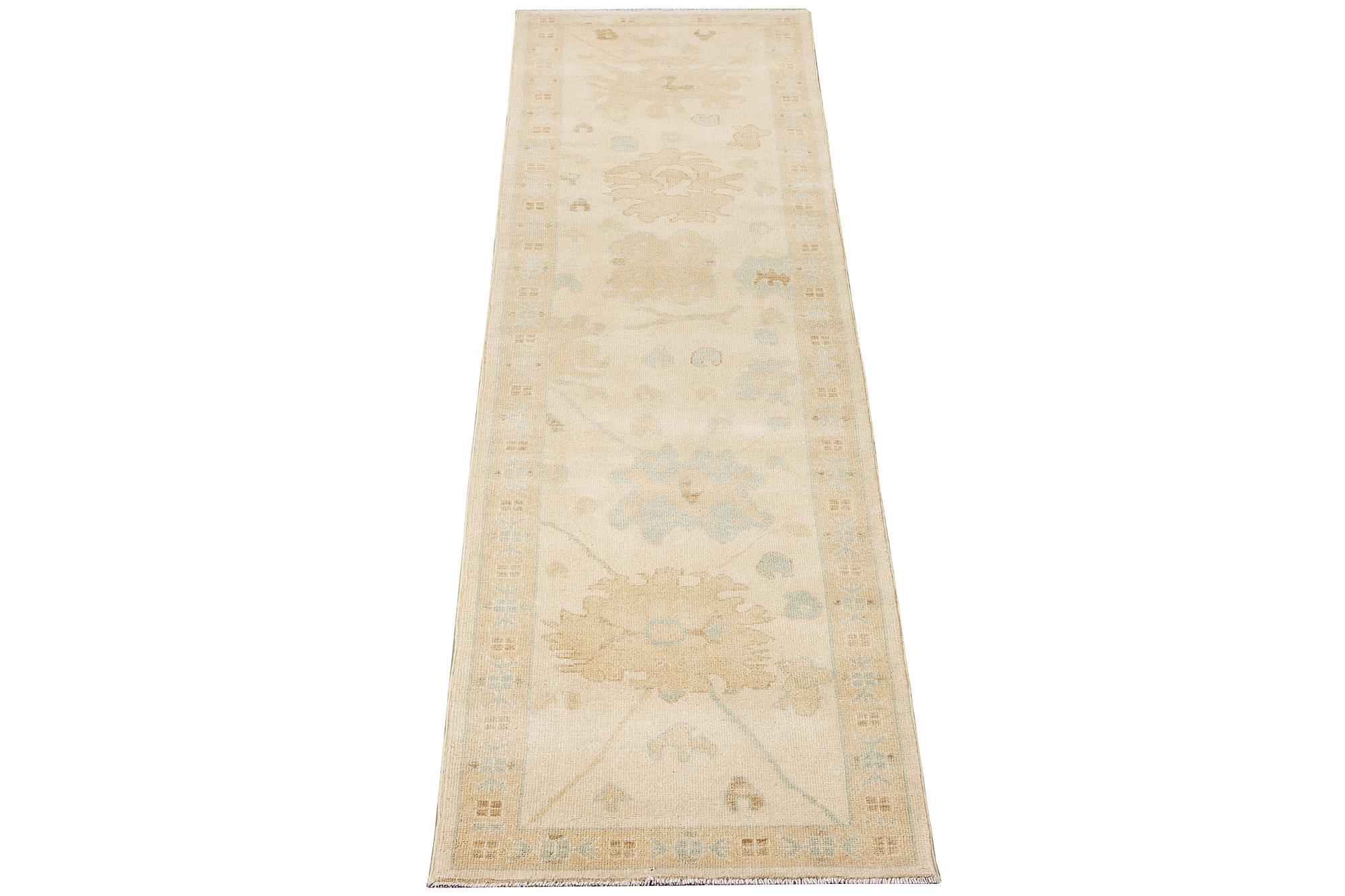 An Ushak runner carpet, c. 360 x 80 cm.