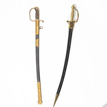 A Swedish police sabre and cutlass, with scabbards.