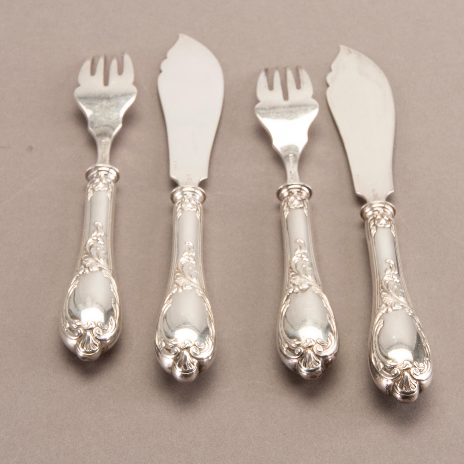 A German 20th century set of 12 fish cutlery low grade silver mark of F W Hespe hamburg early 1900s.