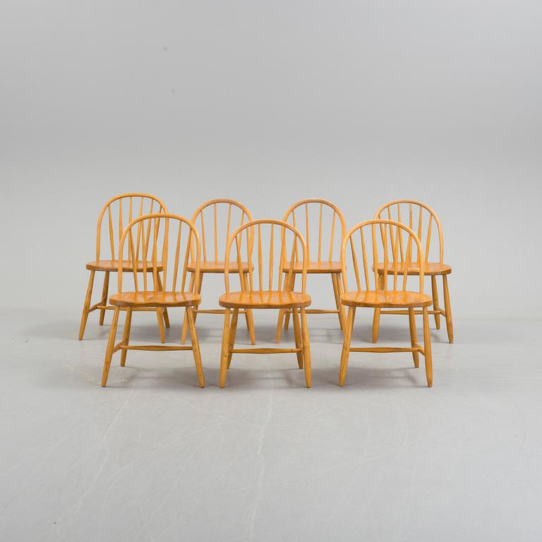 Seven matched mid 20th Century birch and beech chairs.