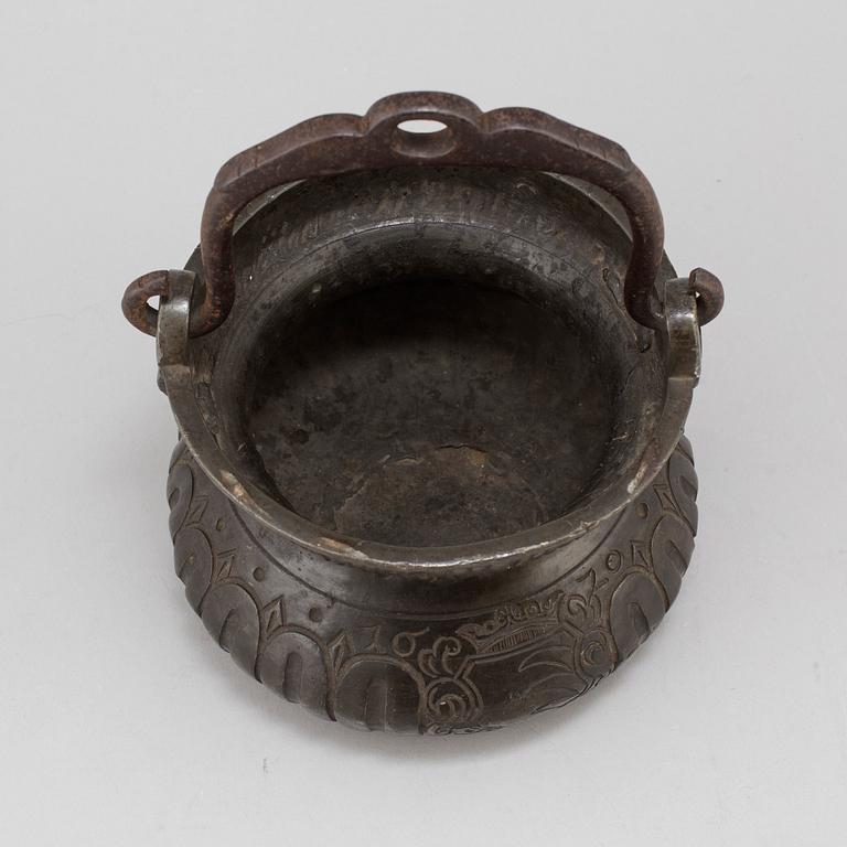 A holy water bowl dated 1620.