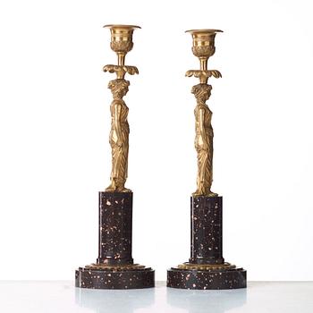 A pair of late Gustavian circa 1800 porphyry and bronze candlesticks.