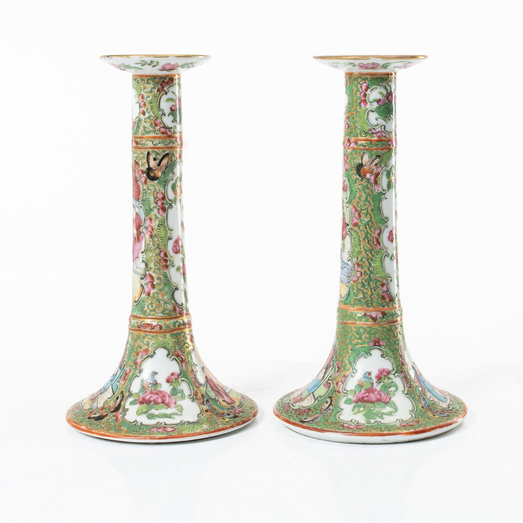 A pair of famille rose Canton candle sticks, Qing dynasty, 19th century.