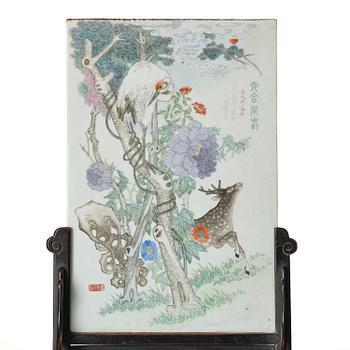 A Chinese famille rose porcelain table screen with hardwood stand, 20th century.