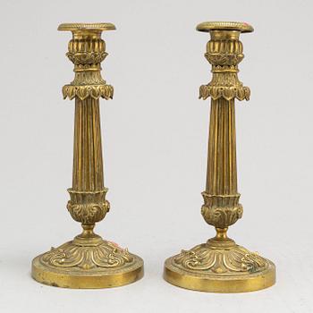 A pair of Empire bronze candlesticks, first half of the 19th century.