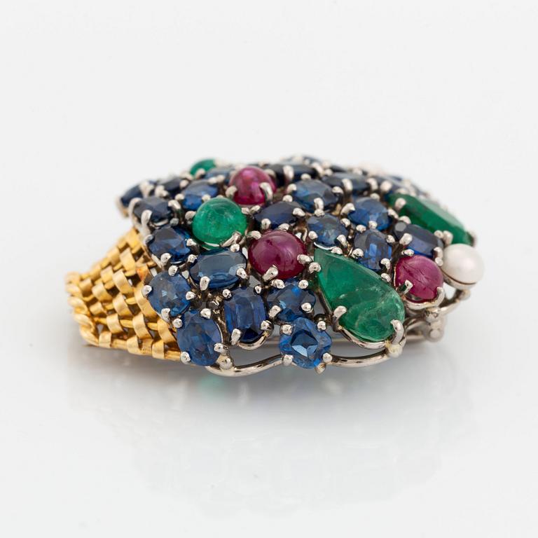 An 18K gold Carlman brooch set with sapphires, emeralds, rubies and pearls.