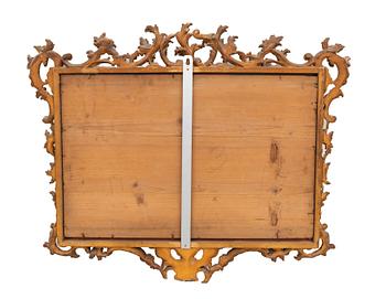 A gilded Louis XV style mirror around 1900.