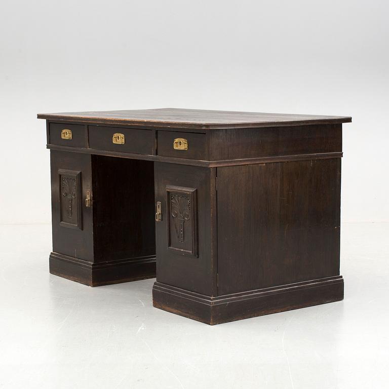 An early 1900s oak writing desk.