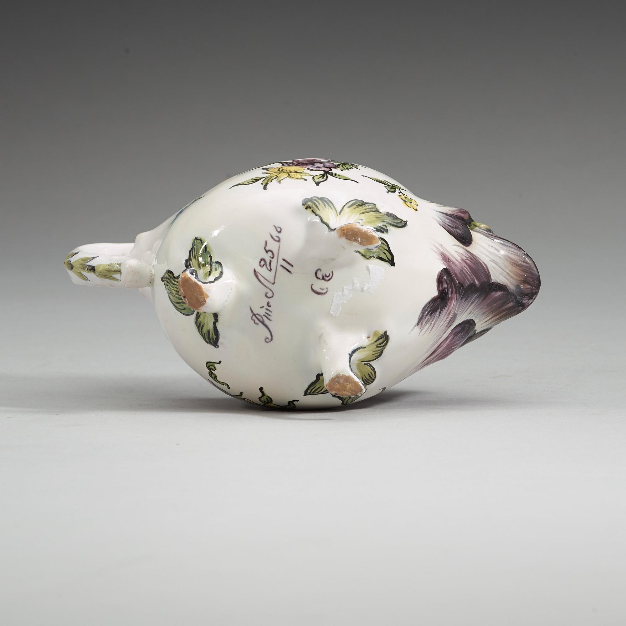 A Swedish faience sauce boat, Rörstrand, dated 25/11 (17)66.